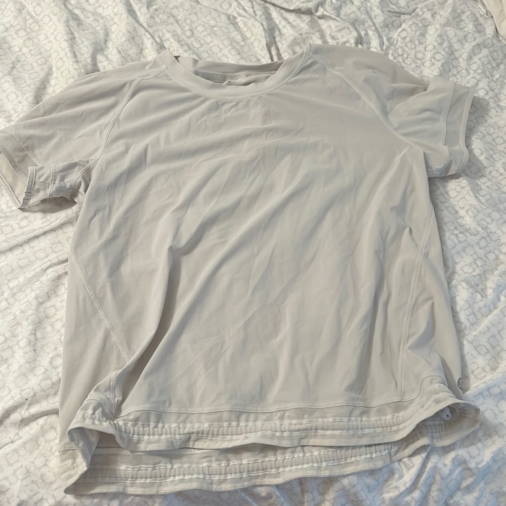 two stains. one on the back and a small one on the back of the sleeve